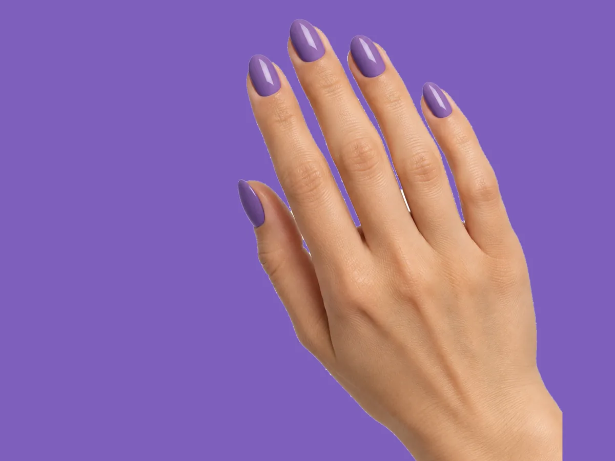 A hand with jacaranda-purple nails on a purple background, from the Second Coat concept project.